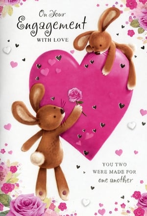 Celebrate a truly special moment with our delightful 'Engagement' card from Simon Elvin. This heartwarming design features two adorable bunnies, one lovingly presenting a rose to the other, set against a vibrant pink heart. The sweet message 'On Your Engagement WITH LOVE' and 'YOU TWO WERE MADE FOR one another' beautifully conveys the joy and romance of finding a perfect match. Adorned with charming roses and scattered hearts, this card is a wonderfully sentimental way to send your warmest wishes. Perfect for any couple embarking on their journey together, this card is sure to bring a smile. Available in a convenient pack of 6, it's an ideal choice for retailers.