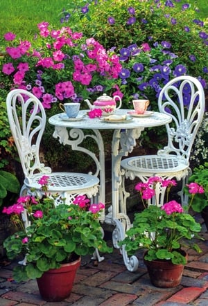 Introduce a touch of garden charm to your greeting card selection with our 'Open Birthday Female' cards, from trusted supplier Simon Elvin. This enchanting design features a serene garden scene, complete with a classic white wrought iron table and chairs, set against a vibrant backdrop of blooming pink and purple flowers. A delicate teapot and teacups await, evoking a peaceful tea party atmosphere. Potted geraniums add a homely touch, making this card a truly lovely choice for celebrating any female's birthday. Each wholesale pack contains 6 beautifully designed cards, perfect for offering your customers a delightful way to send their best wishes.