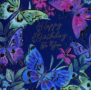 Delight your customers with this exquisite 'Open Birthday Female' card from Simon Elvin. Adorned with a vibrant array of blue, purple, and teal butterflies fluttering amongst delicate pink flowers, all set against a rich navy background. The elegant 'Happy Birthday To You' script adds a touch of sophistication.
This beautiful design is perfect for celebrating any special woman's birthday, offering a truly eye-catching option for your card display. Stock up on these popular cards, available in convenient packs of 6, and add a splash of colour and charm to your retail offering. A must-have for any card selection.