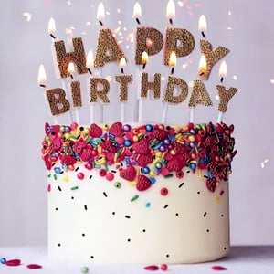 Bring a burst of joy to any celebration with our Open Birthday Female cards, proudly supplied by Simon Elvin. This delightful greeting card features a beautifully decorated white cake, adorned with a vibrant array of multi-coloured sprinkles – from classic sticks and cheerful beads to charming strawberry-shaped pieces. The cake is crowned with sparkling gold glitter 'Happy Birthday' candles, all aglow, creating a truly festive and inviting scene. Perfect for any female recipient, these cards offer a warm and celebratory message that isn't age-specific. Supplied in a convenient wholesale pack of 6, this eye-catching design is a must-have for your greeting card selection, promising to bring smiles to your customers.