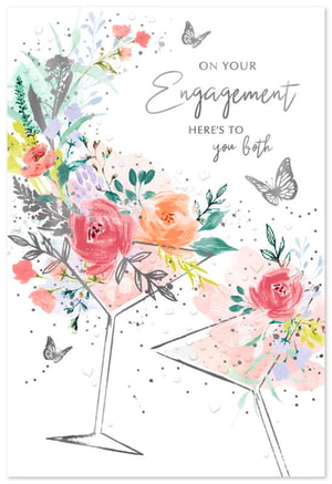 Celebrate a special engagement with this exquisite card from Simon Elvin. Its modern watercolour design features elegant martini glasses brimming with delicate pink and peach flowers, beautifully accented by graceful silver butterflies. The heartfelt message, 'On Your Engagement, Here's to You Both,' offers the perfect sentiment for the happy couple. This charming card provides a sophisticated and celebratory touch for any engagement occasion. Stock up with our convenient pack of 6 to ensure your customers can share their warmest wishes.