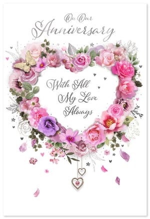 Presenting the 'Our Wedding Anniversary' card, a truly enchanting design from Simon Elvin. This beautiful card features a captivating heart-shaped floral wreath, bursting with an array of delicate pink and purple blooms, elegantly accented by a golden butterfly. The heartfelt message 'On Our Anniversary' graces the top, while 'With All My Love Always' is lovingly displayed within the floral heart, all in sophisticated silver script. Complete with charming hanging heart embellishments, this card is perfect for celebrating a special milestone. Stock up with our convenient pack of 6 and offer your customers a touch of romance and elegance.