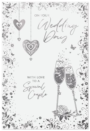 Celebrate the happy couple's special day with this exquisite 'Wedding Day' card from Simon Elvin. Designed with a timeless silver and white palette, this elegant card features beautifully intricate details that are sure to impress.

The front of the card showcases delicate hanging hearts, one with an ornate design, alongside charming butterflies and swirling floral motifs. Two champagne flutes clink in celebration, surrounded by sparkling accents, perfectly capturing the joy of the occasion. The heartfelt message "ON YOUR Wedding Day" and "WITH LOVE TO A Special Couple" is presented in a lovely script and classic font.

Perfect for retailers looking to offer a sophisticated option for wedding greetings, these cards come in a convenient pack size of 1x6. Stock up on this delightful design and help your customers share their warmest wishes.