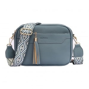 Introduce your customers to the effortlessly chic Equilibrium Front Pocket Cross Body Bag in a beautiful blue hue. This stylish accessory is designed for both fashion and function, making it a must-have for any wardrobe.

Crafted with a lovely pebbled texture, this bag features a convenient front pocket and a secure main compartment, perfect for keeping essentials organised. The standout feature is its eye-catching, wide woven strap, adorned with a contemporary geometric pattern in complementary tones, adding a touch of modern flair. Finished with elegant gold-tone hardware and a playful tassel charm, it offers a sophisticated yet casual look.

Ideal for everyday errands or a weekend outing, this versatile cross-body bag combines practicality with undeniable style. Supplied as single units by Y and L Company Ltd.