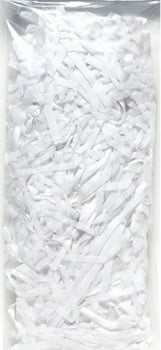 A plastic bag is filled with white shredded paper on a white background.