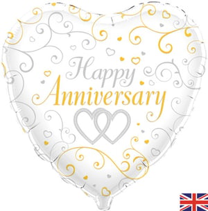 A white heart-shaped balloon that says "Happy Anniversary."