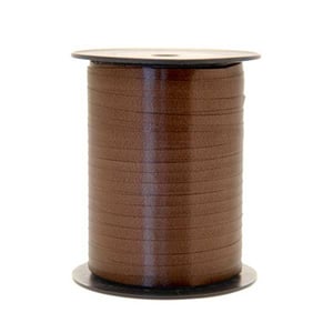 A spool of brown ribbon is on a white background.