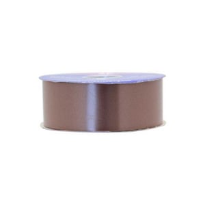 A roll of brown ribbon with a blue label on it.