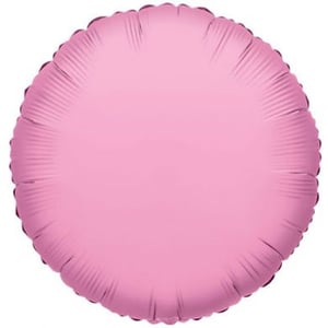 A pink balloon sits on a white surface.