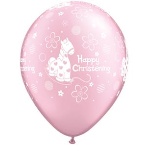 A pink balloon that says "Happy Christening" on it.