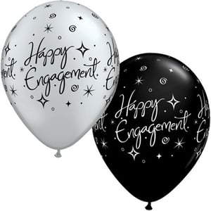 Two balloons that say "Happy Engagement" on them.
