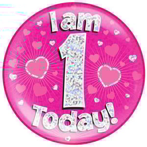 A pink plate with the words "I am 1 today" on it.