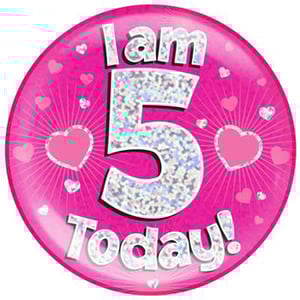 A pink plate with the words "I am 5 today" on it.