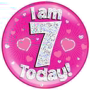 A pink plate with the words "I am 7 today" on it.