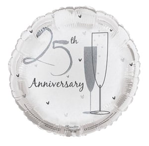 A 25th anniversary balloon with two glasses of champagne on it.