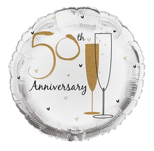 A 50th-anniversary balloon with two glasses of champagne on it.