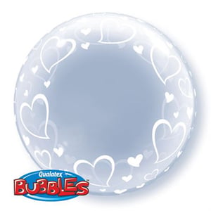 A clear Qualatex bubble with white hearts on it.