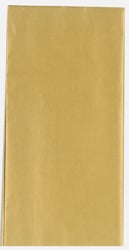 A piece of gold tissue paper is sitting on a white surface.
