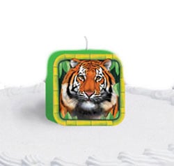 A square candle with a picture of a tiger on it.