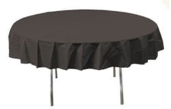 A round table with a black tablecloth on it.