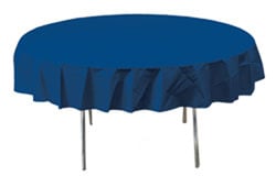 A round table with a blue tablecloth on it.