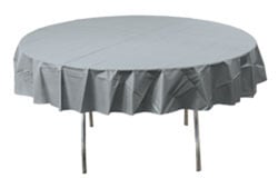 A round table with a grey tablecloth on it.
