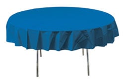 A round table with a blue tablecloth on it.