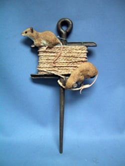 Two mice are sitting on a spool of string.
(This sentence is already grammatically correct.)