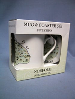 A Norfolk mug and coaster set in a box.
