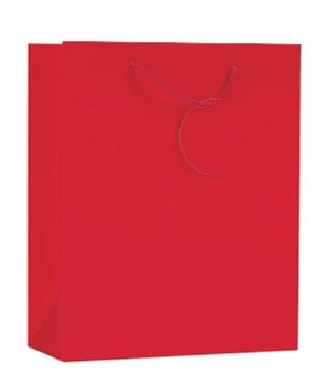 A red gift bag with a tag on it is on a white background.