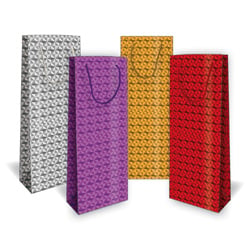 four different colored bags are lined up in a row