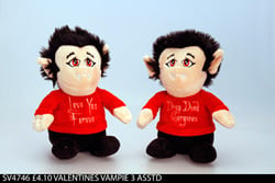 Two stuffed vampires wearing red shirts that say "I love you forever."